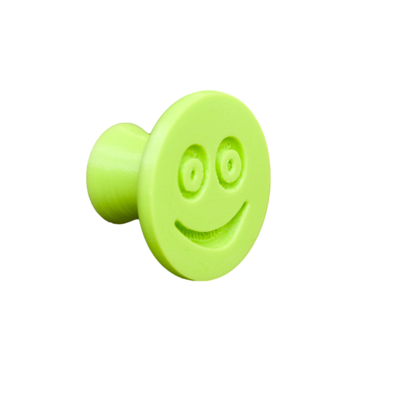 Elastyczna gałka meblowa z uśmiechem, jasnozielona (niebieska), bez z tła.
