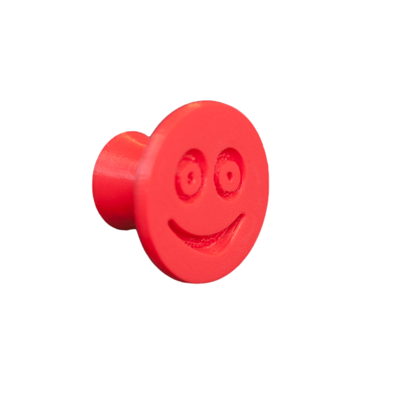 Flexible furniture knob with smile, red, without background.
