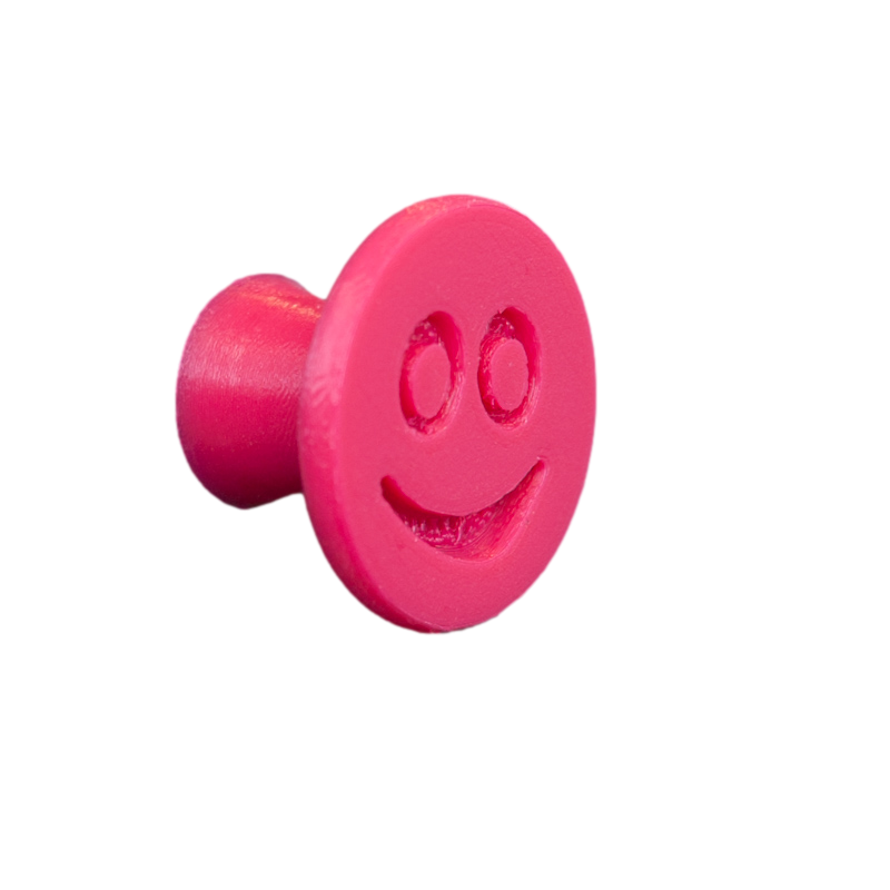 Flexible furniture knob with smile, pink, without background.