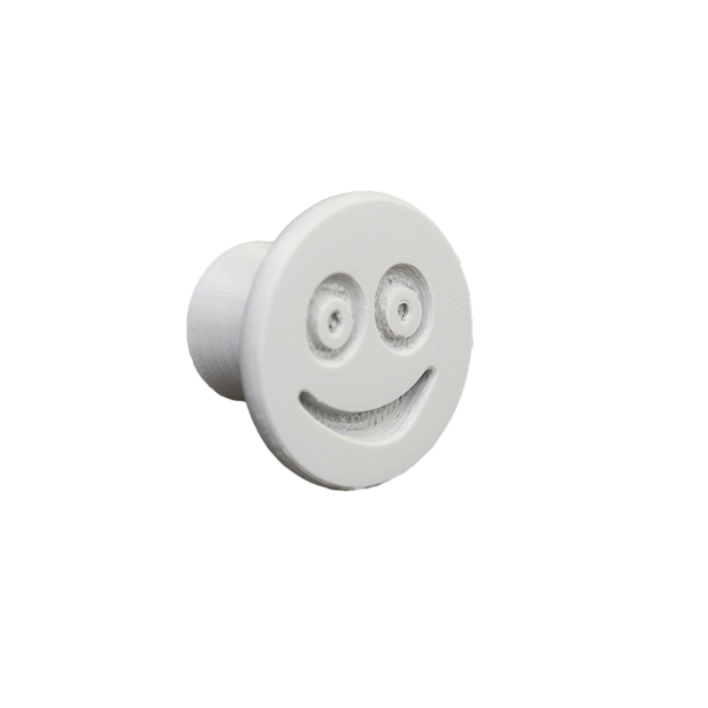 Flexible furniture knob with smile, grey, without background.