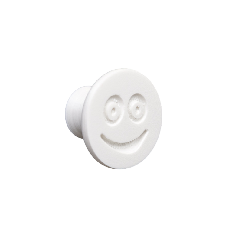 Flexible furniture knob with smile, white, without background.