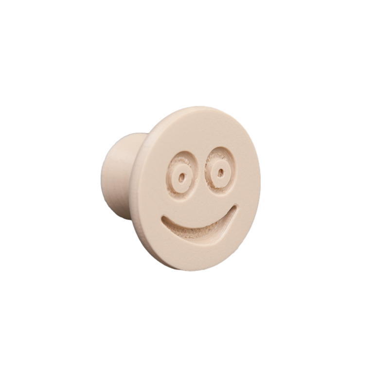 Flexible furniture knob with smile, beige, without background.